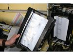 The Gerber Edge thermal transfer printer opened to show a metallic chrome foil with a Welsh Dragon edging design element.